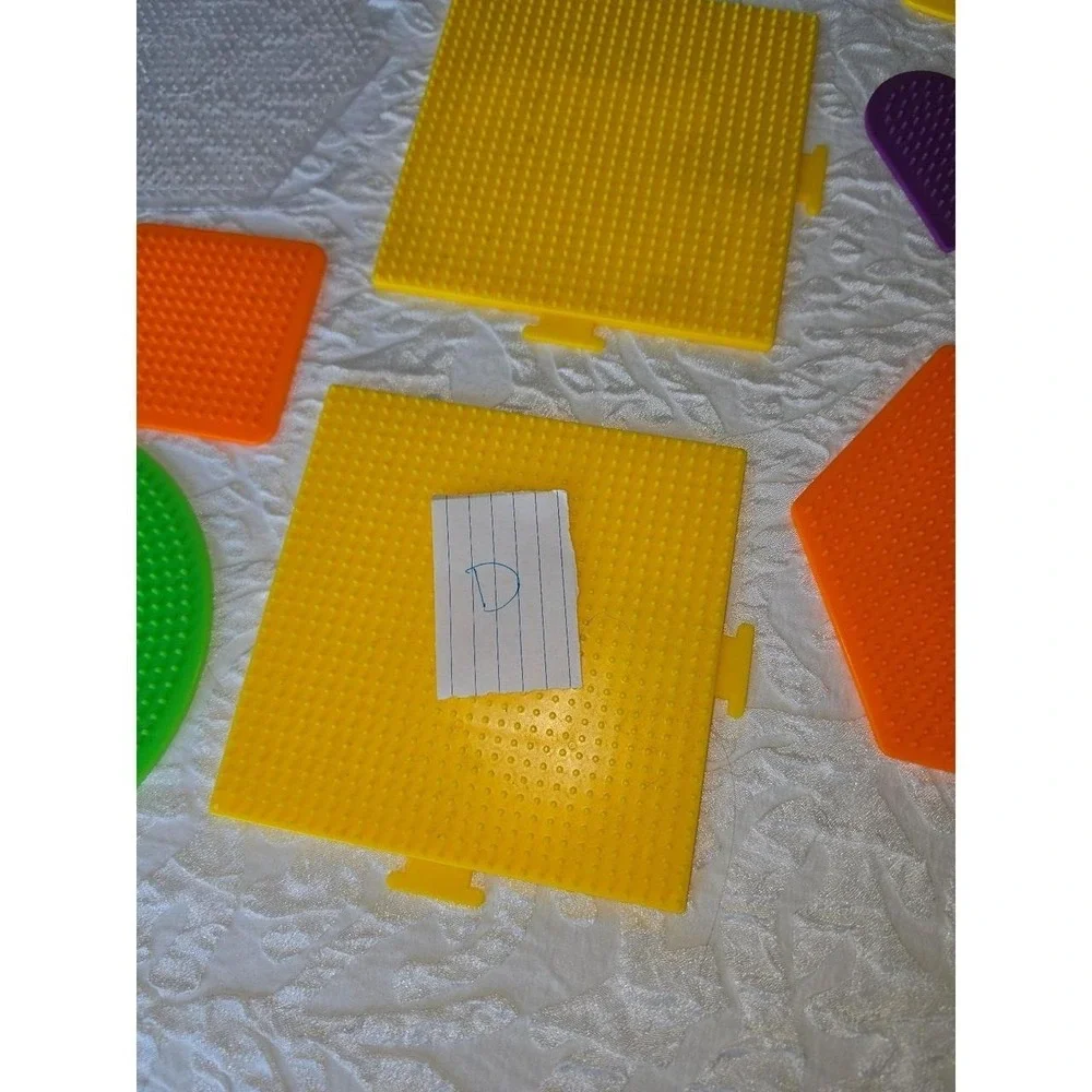 Lot D Perler bead pegboards in various shapes and bright colors